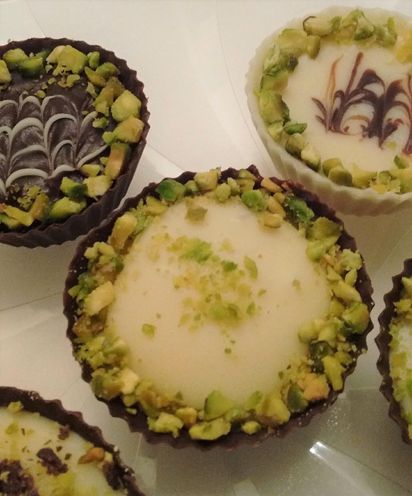 Variety Of White Chocolate Ganache Salted Caramel Filled Cups with Pistachios